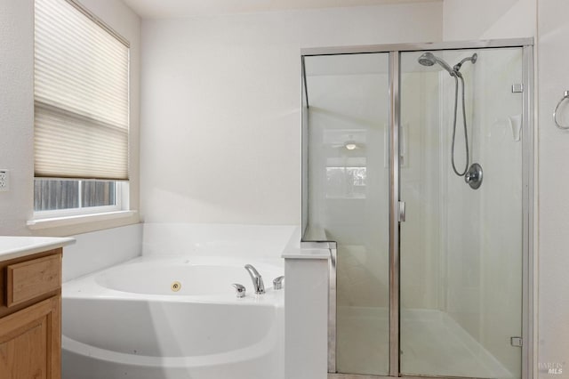 2550 Duncan St, Dixon, CA 95620 - full bath featuring a stall shower, a tub with jets, healthy amount of natural light, and vanity