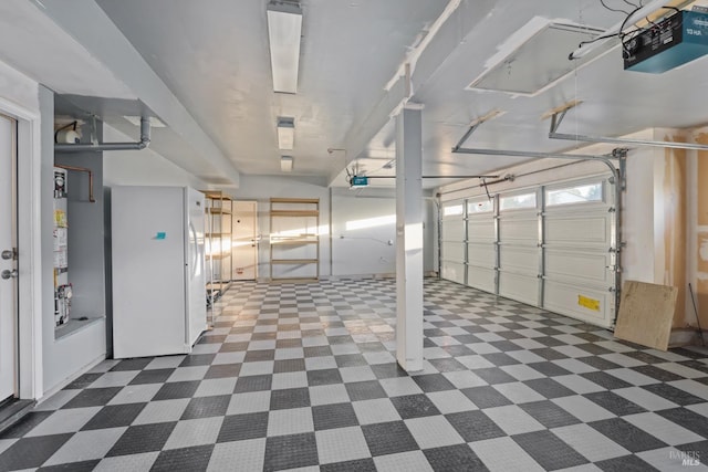2550 Duncan St, Dixon, CA 95620 - garage with a garage door opener and freestanding refrigerator
