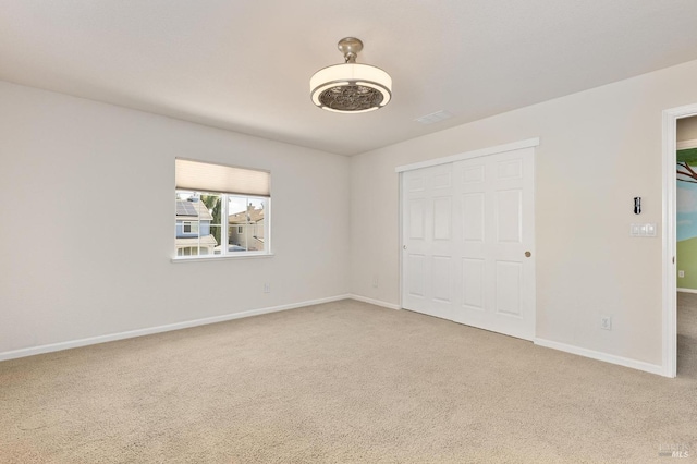 2550 Duncan St, Dixon, CA 95620 - unfurnished bedroom with carpet floors, baseboards, and a closet
