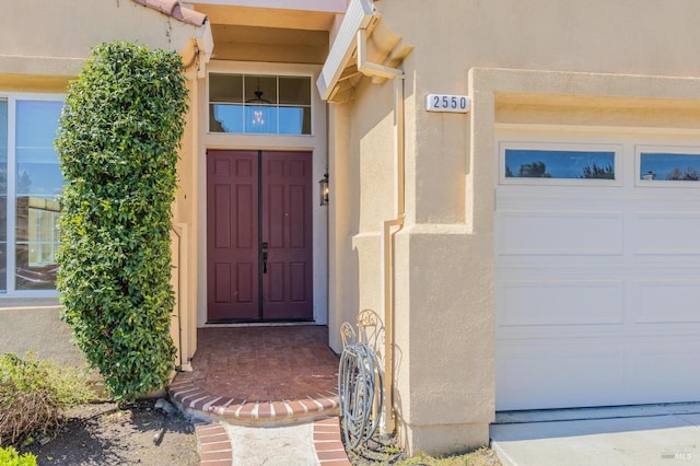 2550 Duncan St, Dixon, CA 95620 - doorway to property with stucco siding and a garage