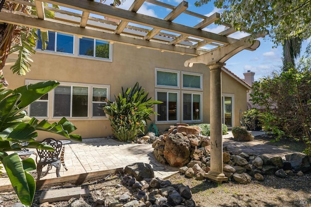 2550 Duncan St, Dixon, CA 95620 - rear view of property featuring stucco siding, a patio area, and a pergola