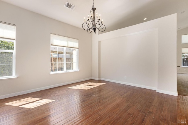 2550 Duncan St, Dixon, CA 95620 - unfurnished room featuring a chandelier, plenty of natural light, and hardwood / wood-style flooring