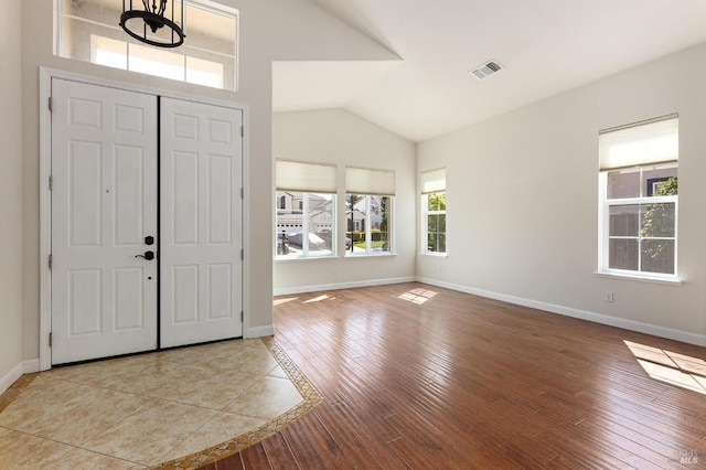2550 Duncan St, Dixon, CA 95620 - entrance foyer with hardwood / wood-style floors, vaulted ceiling, and baseboards