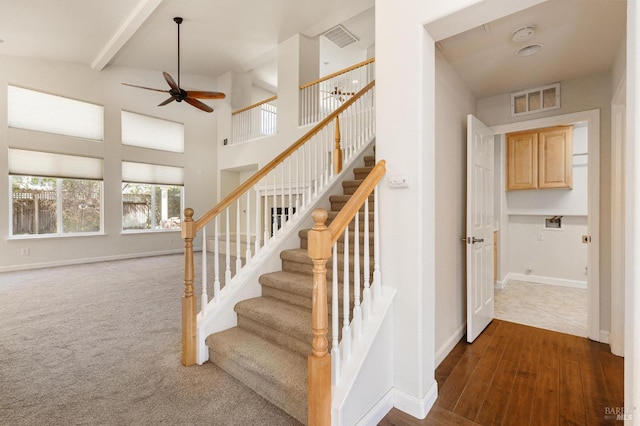 2550 Duncan St, Dixon, CA 95620 - staircase with a ceiling fan, baseboards, a towering ceiling, and wood finished floors