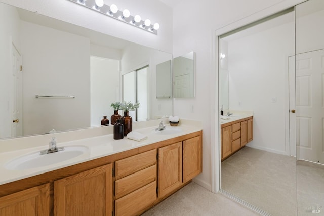 full bathroom featuring double vanity and a sink