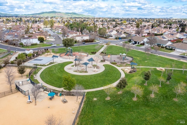 birds eye view of property with a mountain view and a residential view