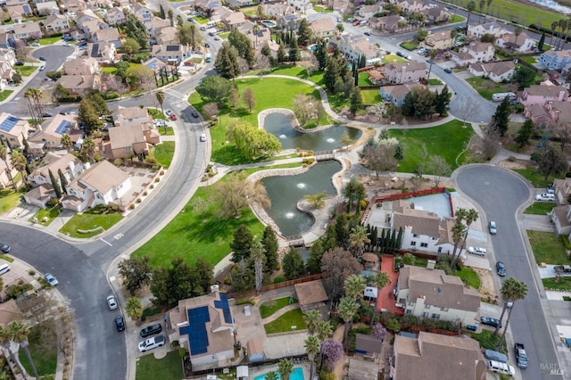 bird's eye view featuring a residential view and a water view