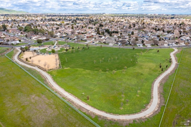 birds eye view of property with a residential view