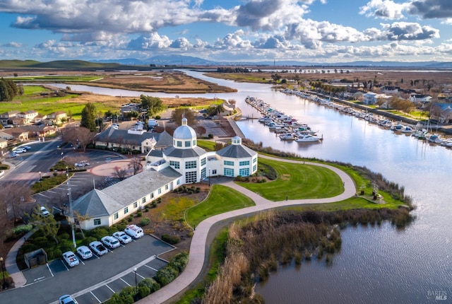 birds eye view of property with a water view