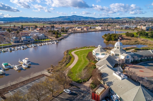 drone / aerial view with a water and mountain view