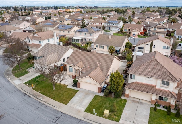 birds eye view of property with a residential view