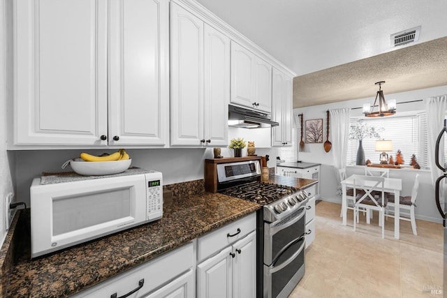 kitchen featuring visible vents, under cabinet range hood, double oven range, white cabinetry, and white microwave