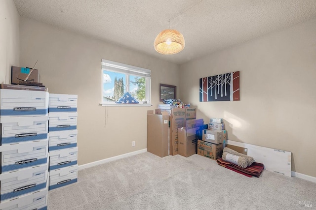 interior space with baseboards and a textured ceiling