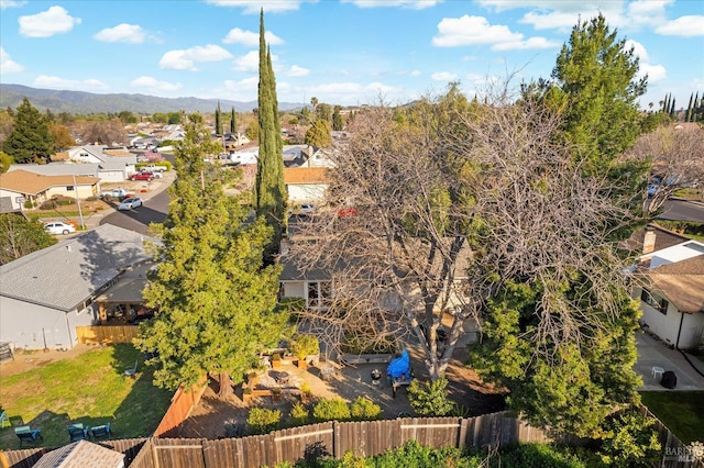 birds eye view of property with a mountain view and a residential view