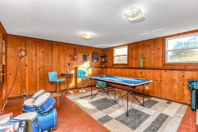 recreation room featuring tile patterned flooring, billiards, a wealth of natural light, and a textured ceiling