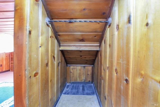 details with wooden walls, carpet flooring, and wood ceiling