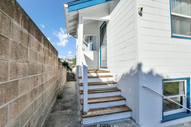 doorway to property with fence