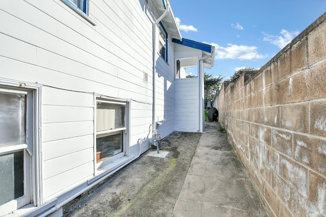 view of property exterior featuring fence