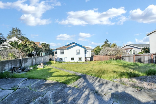 exterior space with a lawn and fence private yard