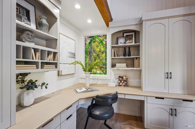 office featuring beamed ceiling, recessed lighting, built in study area, and wood finished floors