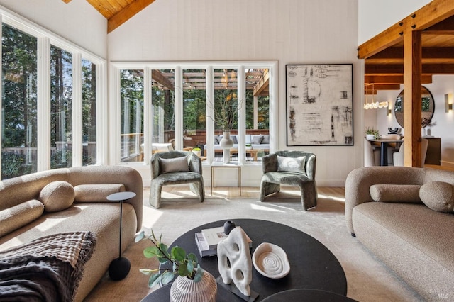 living room featuring high vaulted ceiling