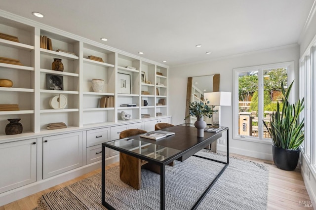 office space featuring recessed lighting, light wood-style floors, baseboards, and ornamental molding