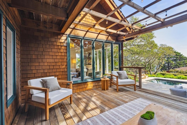 deck with a pergola and an outdoor pool