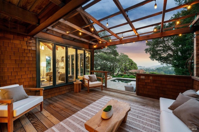 deck at dusk with a pergola