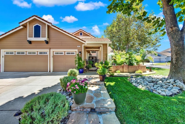 view of front facade with a tiled roof, driveway, and an attached garage