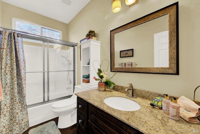 full bath with visible vents, toilet, lofted ceiling, shower / bath combination with glass door, and vanity