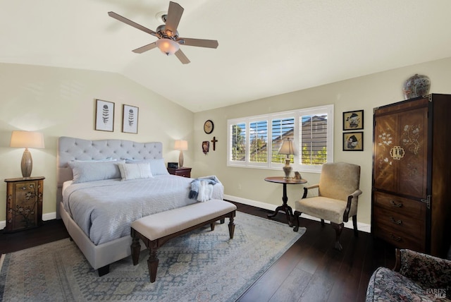 bedroom with ceiling fan, baseboards, dark wood-type flooring, and lofted ceiling