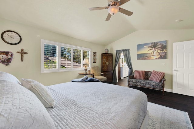 bedroom featuring baseboards, a ceiling fan, dark wood-type flooring, and lofted ceiling