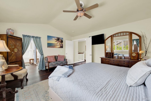 bedroom with a ceiling fan, lofted ceiling, and wood finished floors