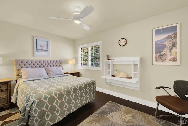 bedroom featuring ceiling fan, baseboards, and wood finished floors