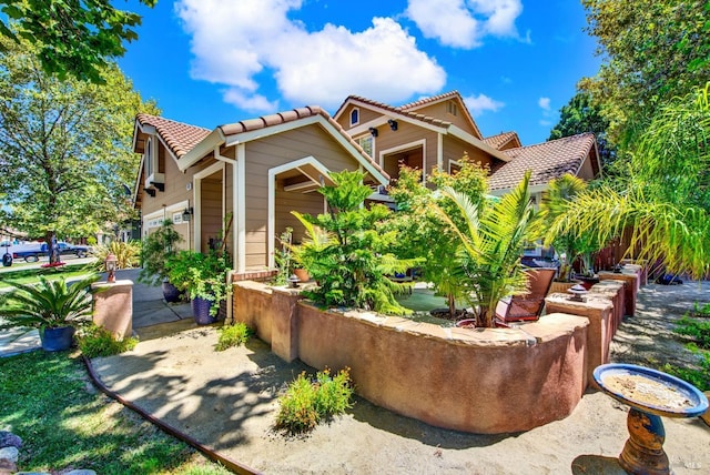 view of front of property with a tile roof