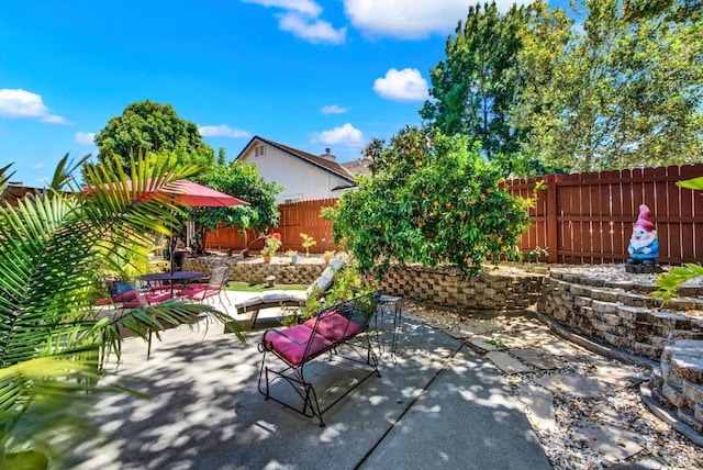 view of patio / terrace featuring outdoor dining area and a fenced backyard