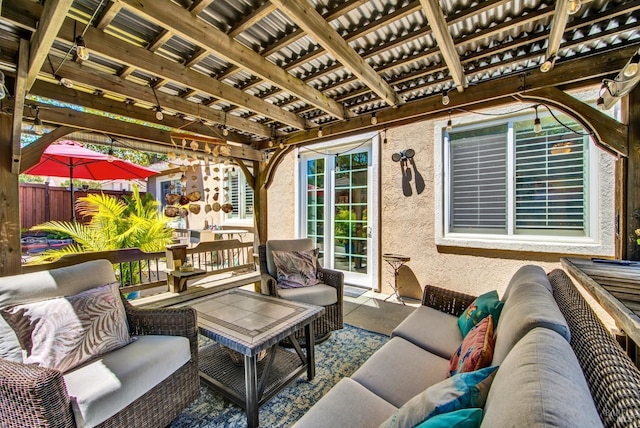 view of patio with an outdoor living space and fence