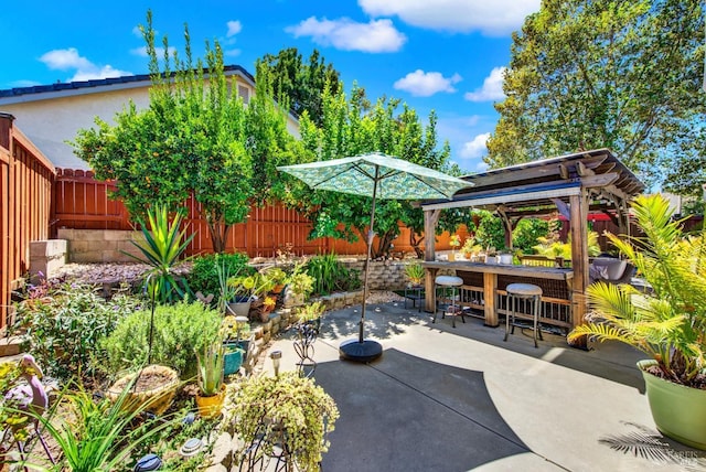 view of patio with outdoor dining area and a fenced backyard