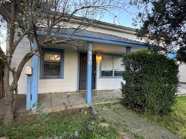 view of front of house with concrete block siding