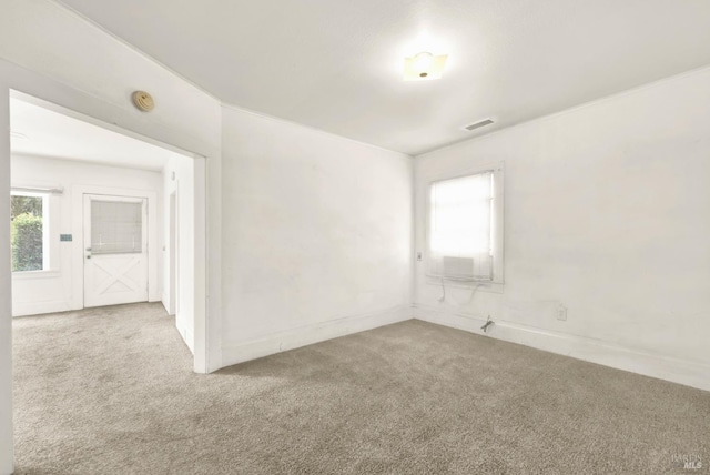 unfurnished room featuring visible vents and carpet floors