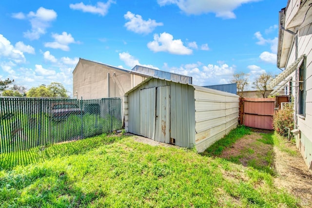 view of shed with a fenced backyard