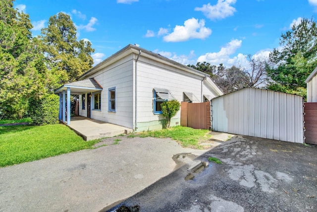 exterior space with a lawn and fence