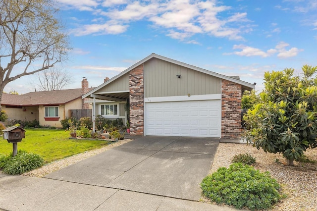 view of front facade featuring brick siding, driveway, a front yard, and a garage