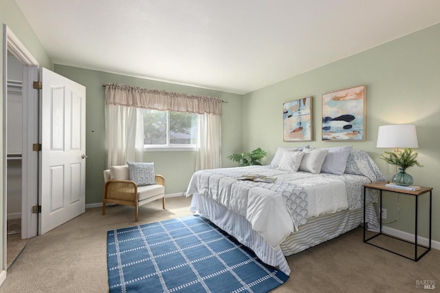 carpeted bedroom with baseboards