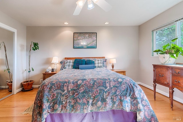 bedroom featuring recessed lighting, baseboards, light wood-type flooring, and ceiling fan