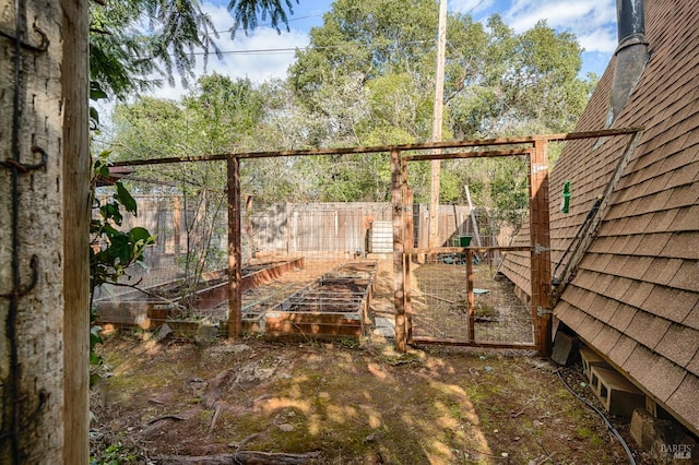 view of yard with a garden and fence