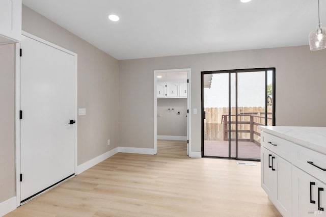 interior space with recessed lighting, light wood-type flooring, baseboards, and visible vents