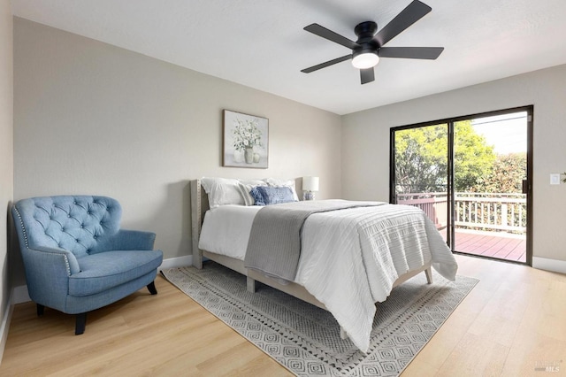 bedroom with access to outside, baseboards, and light wood-type flooring