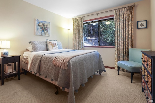 carpeted bedroom with baseboards