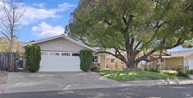 single story home with a garage, a front yard, driveway, and fence